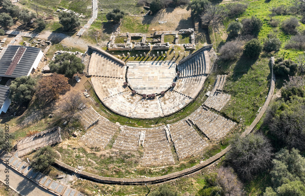 Torbali, Izmir, Turkey: View of the reconstructed theater in the ancient site of Metropolis in Izmir, Turkey, with the village of Yeniköy in the background.
