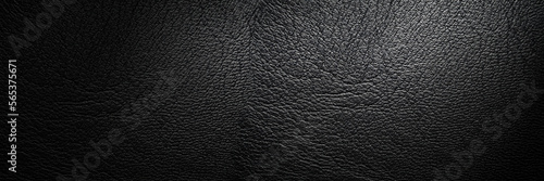 Black leather texture with vignette close-up. Canvas. Packing material. Luxury leather background with empty space for design. Top view web banner
