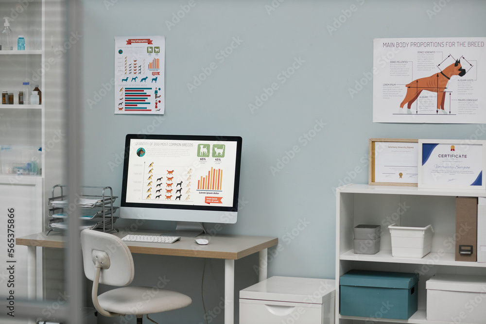 Workplace of vet expert with information on screen of computer monitor Workplace of vet expert with information on screen of computer monitor