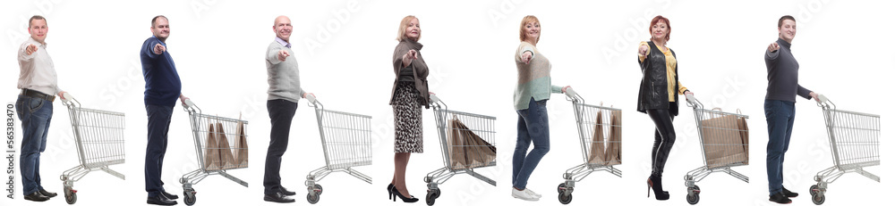 a group of people with a shopping cart point their finger at the camera a group of people with a shopping cart point their finger at the camera