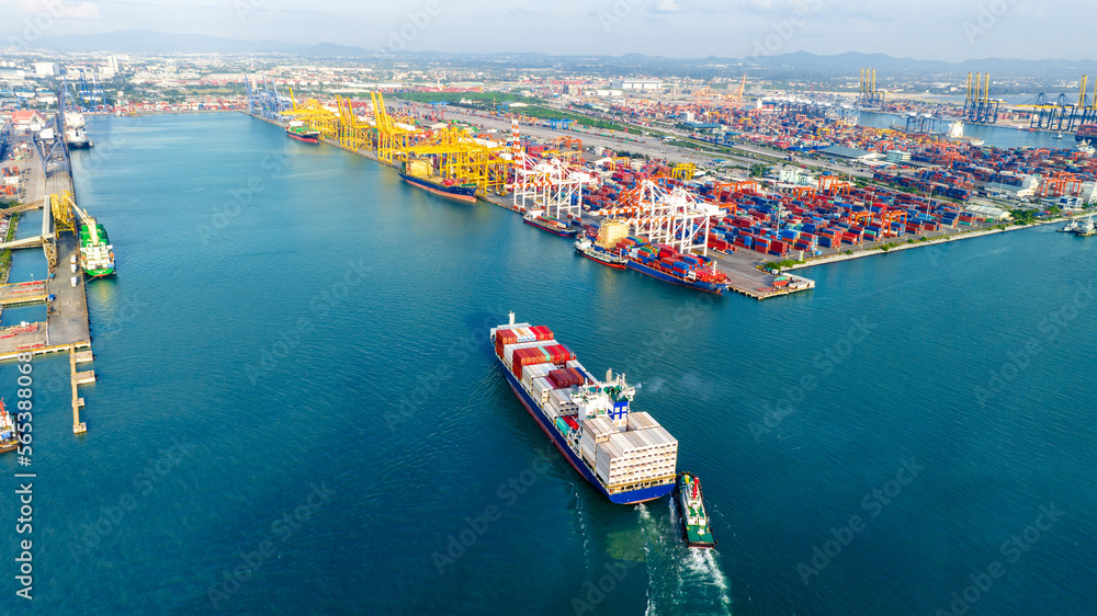 Tub Boat with Stern of cargo ship carrying container and running for import goods from cargo yard port to custom ocean concept technology transportation , customs clearance. top view