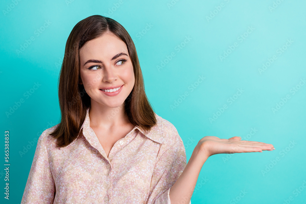 Portrait of lovely young lady curious look palm hold copyspace dressed stylish smart casual outfit isolated on aquamarine color background Portrait of lovely young lady curious look palm hold copyspace dressed stylish smart casual outfit isolated on aquamarine color background