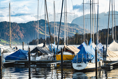 Yacht port on Lake Lucerne, Alps peaks in the background, view from the city of Lucerne, Switzerland, autumn. © Gerard