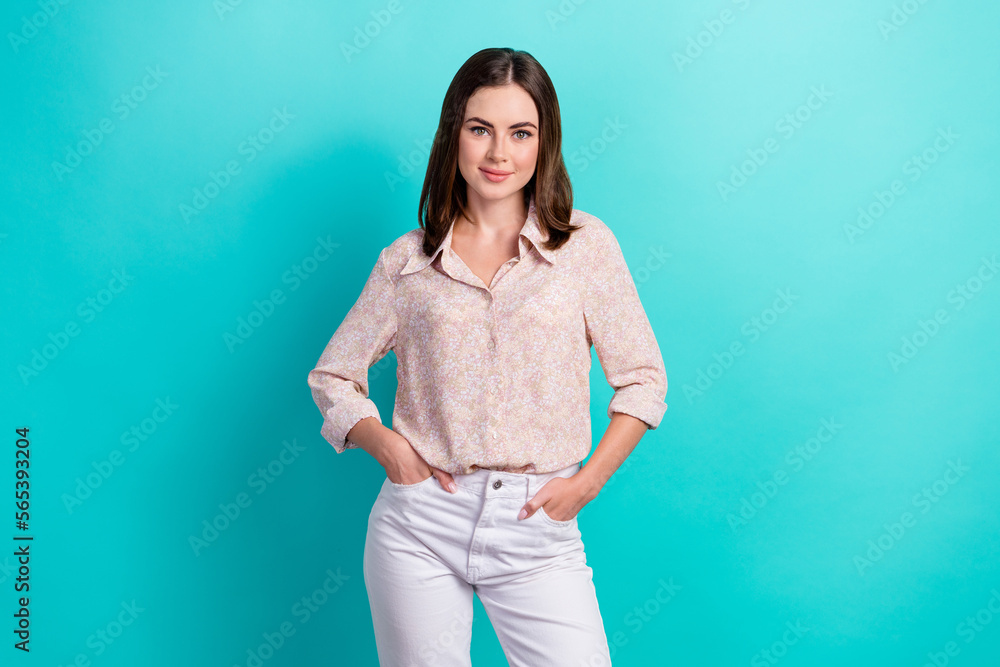 Photo portrait of nice young girl hold arms pockets confident dressed stylish smart casual look isolated on aquamarine color background Photo portrait of nice young girl hold arms pockets confident dressed stylish smart casual look isolated on aquamarine color background