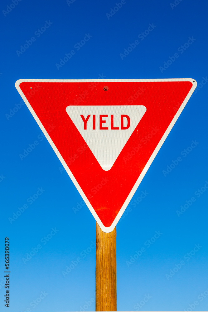 yield Sign at the highway with blue sky yield Sign at the highway with blue sky
