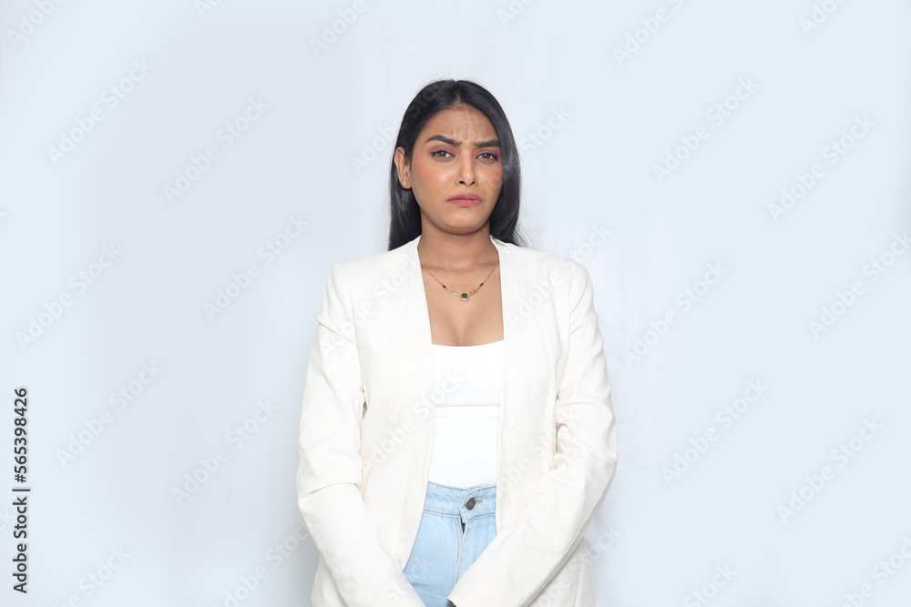 Asian Corporate woman frowning disappointed, standing upset and distressed against white background. Image of sad office Woman. Asian Corporate woman frowning disappointed, standing upset and distressed against white background. Image of sad office Woman.