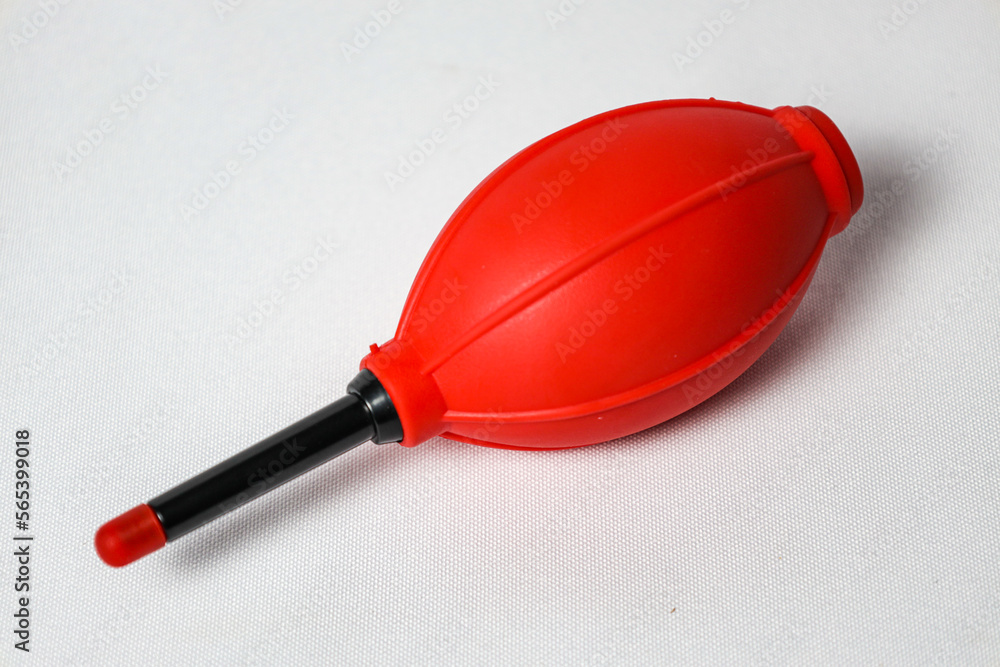 Red Rubber Blower on White Background. Close-up Image Red Rubber Blower on White Background. Close-up Image