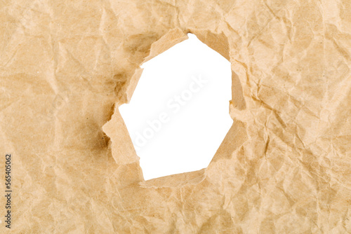 yellow Hole in the paper with torn sides.