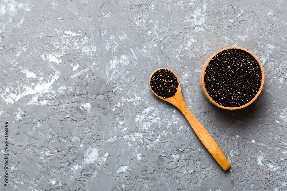 quinoa seeds in bowl and spoon on colored background. Healthy kinwa in small bowl. Healthy superfood quinoa seeds in bowl and spoon on colored background. Healthy kinwa in small bowl. Healthy superfood