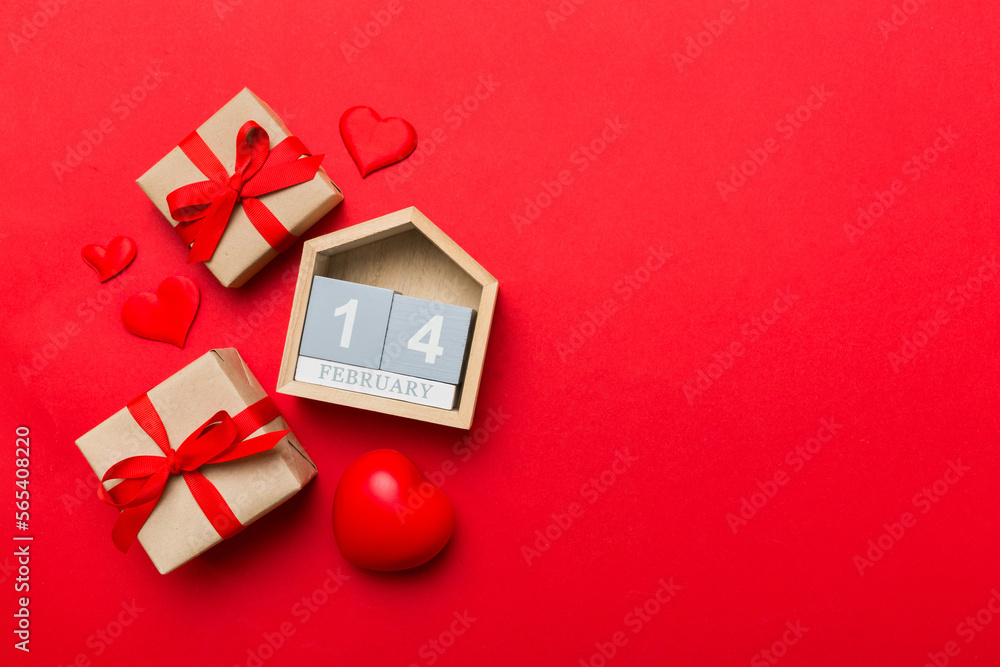 Fototapeta premium Valentine Day theme with wooden block calendar. Greeting card template for Valentines Day copy space for text