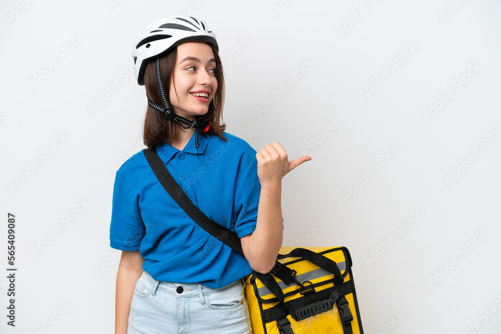 Young Ukrainian woman with thermal backpack isolated on white background pointing to the side to present a product Young Ukrainian woman with thermal backpack isolated on white background pointing to the side to present a product