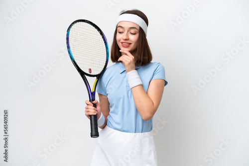 Young Ukrainian tennis player woman isolated on white background looking to the side and smiling © luismolinero