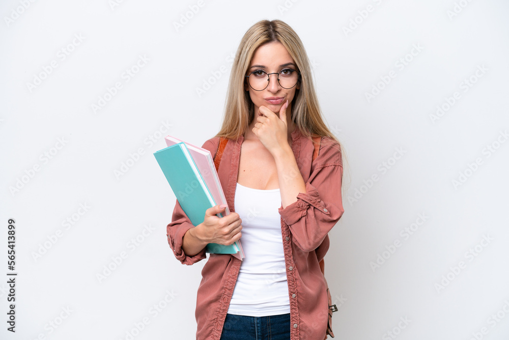 Pretty student blonde woman isolated on white background thinking Pretty student blonde woman isolated on white background thinking