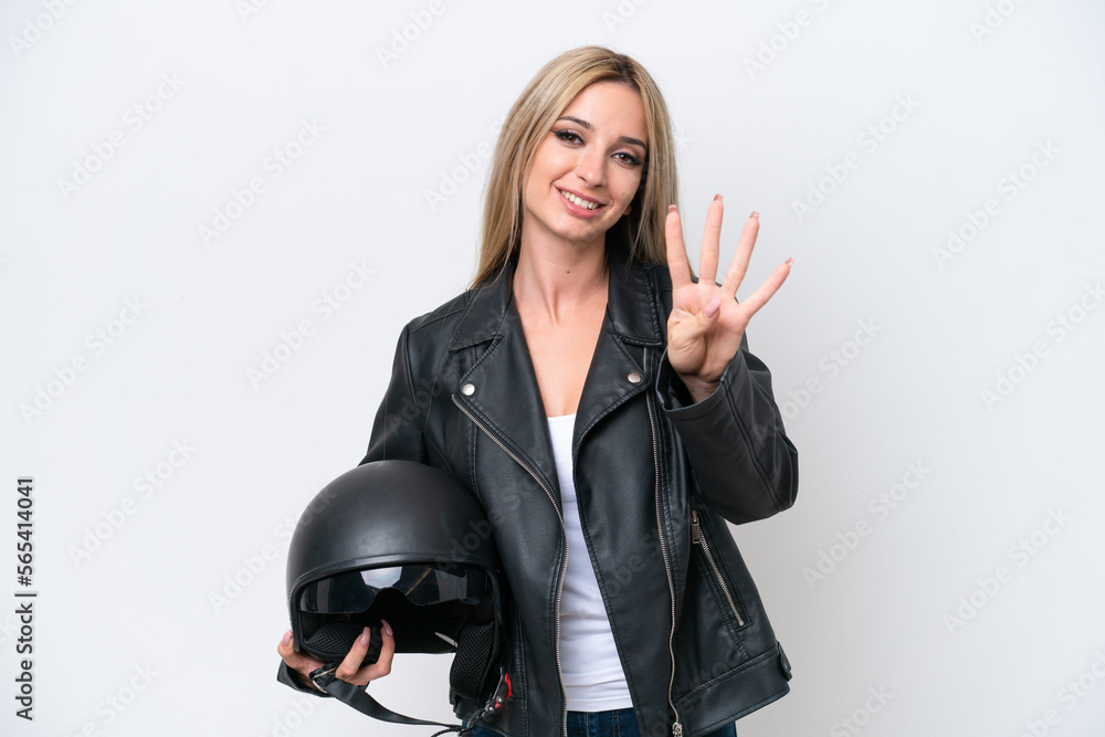 Pretty blonde woman with a motorcycle helmet isolated on white background happy and counting four with fingers Pretty blonde woman with a motorcycle helmet isolated on white background happy and counting four with fingers