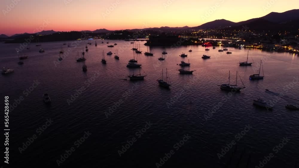 Drone view of Bodrum castle and boats in the sea at sunset Drone view of Bodrum castle and boats in the sea at sunset