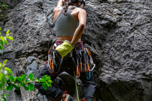 Woman climbing a rock wall
