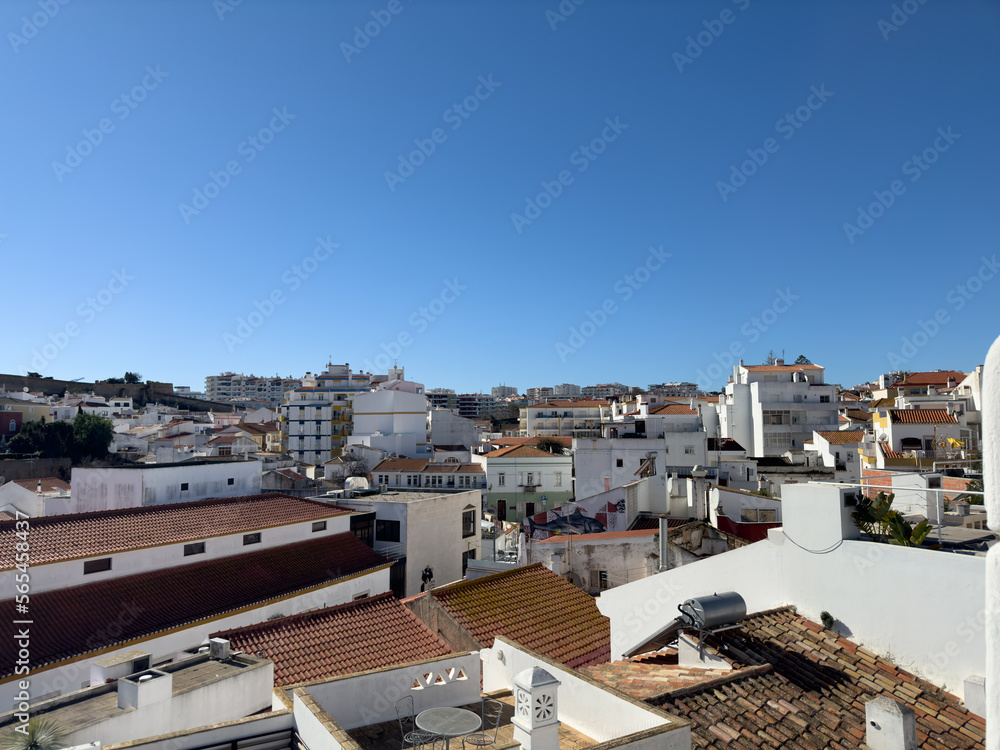 Old town in the center of Lagos, Algarve region, Portugal. Showing beach with blue skies