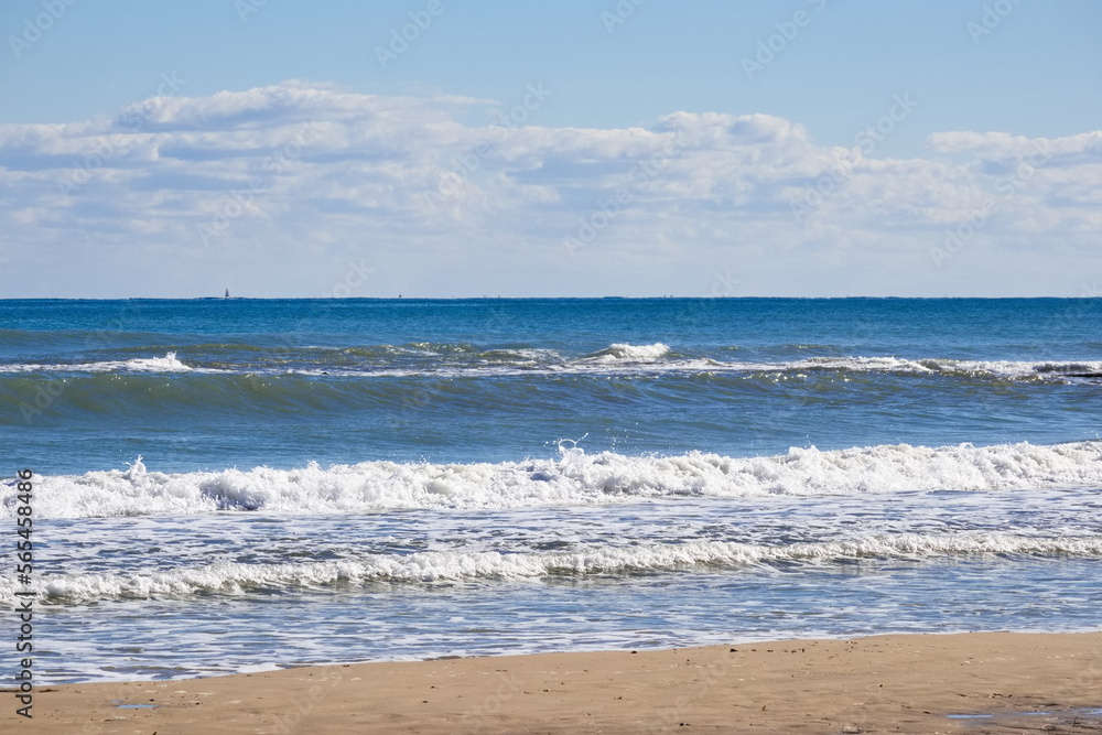 Striking scene of waves breaking on the sand of a Spanish beach	
