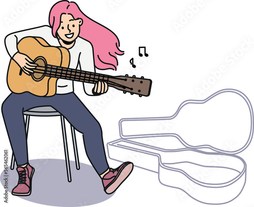 Smiling woman with pink hair play guitar