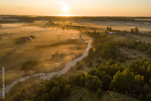Sunset aerial atmospheric view on river in Ural Russia. Drone photography