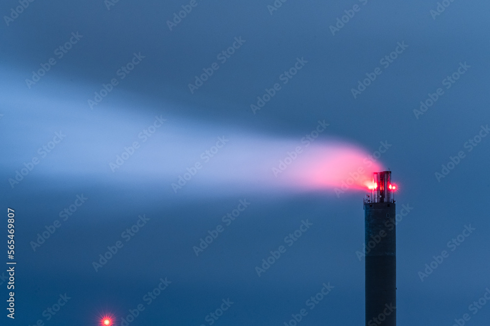 Smoke flowing from a stoke stack at night.