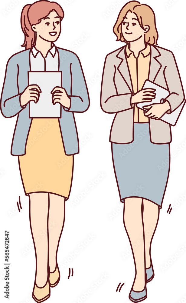 Businesswomen walk talking in office Businesswomen walk talking in office