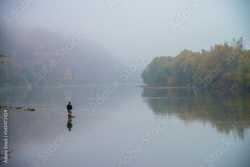 Fishing on the autumn river in the water