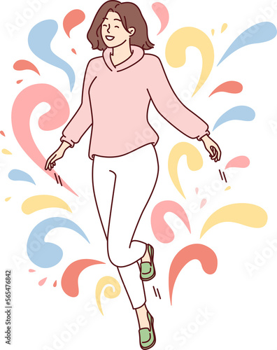 Photography Woman walks in weightlessness and waves arms located among multi-colored drops