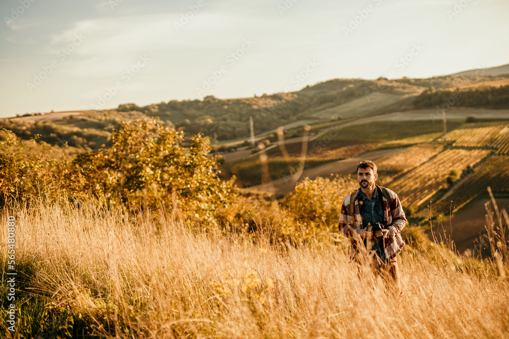 Shot of a young backpacker looking at a view during a hiking day in nature. Copy space. Shot of a young backpacker looking at a view during a hiking day in nature. Copy space.