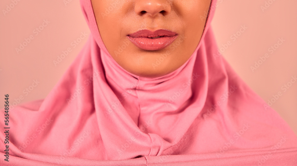 Cropped image of Muslim woman wearing pink hijab. Cropped image of Muslim woman wearing pink hijab.