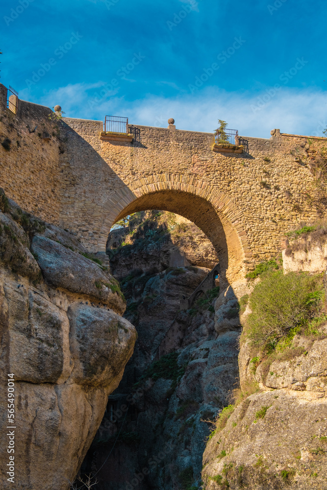 The Old Bridge (Puente Viejo) and the Ronda Gorge (Tajo de Ronda) on the Guadalevin River. Andalusia, province of Malaga, Spain