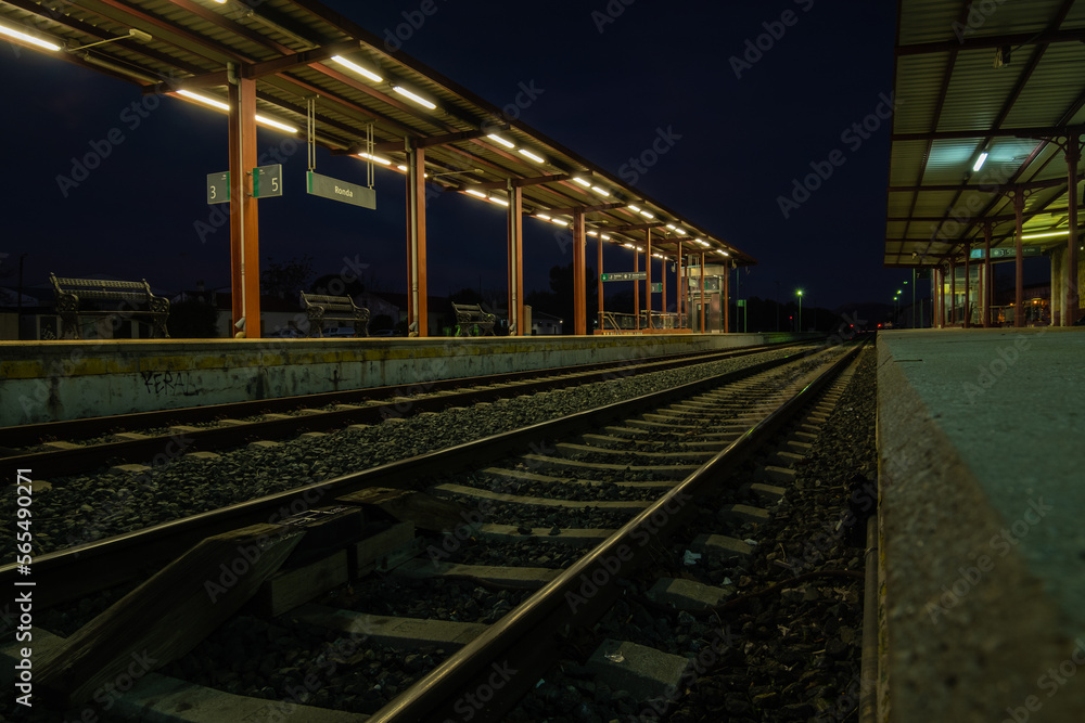 View of tracks at the train station in Ronda at night