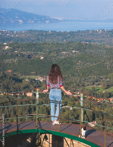 View of Kaiser's Throne observation deck lookout, Pelekas village, Corfu island, Greece, Kaiser William II summit Observatory panoramic summer view with mountains and Kerkyra in the background