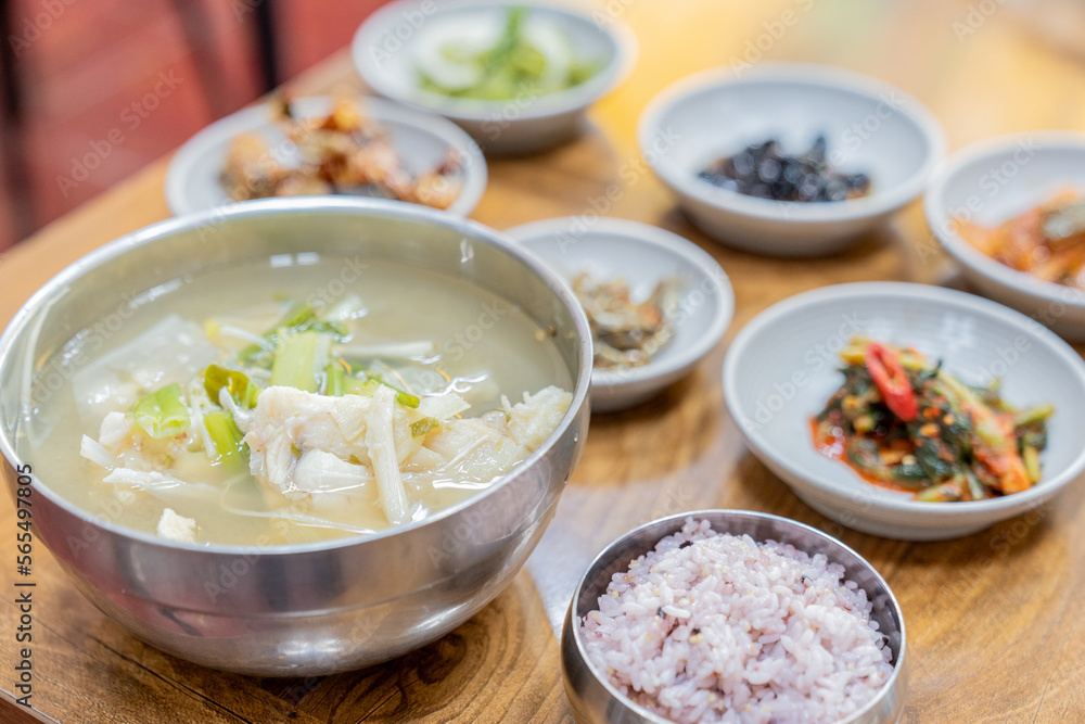 Soup and various side dishes at a Korean restaurant Soup and various side dishes at a Korean restaurant