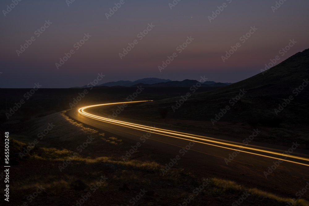 light trails with mountains