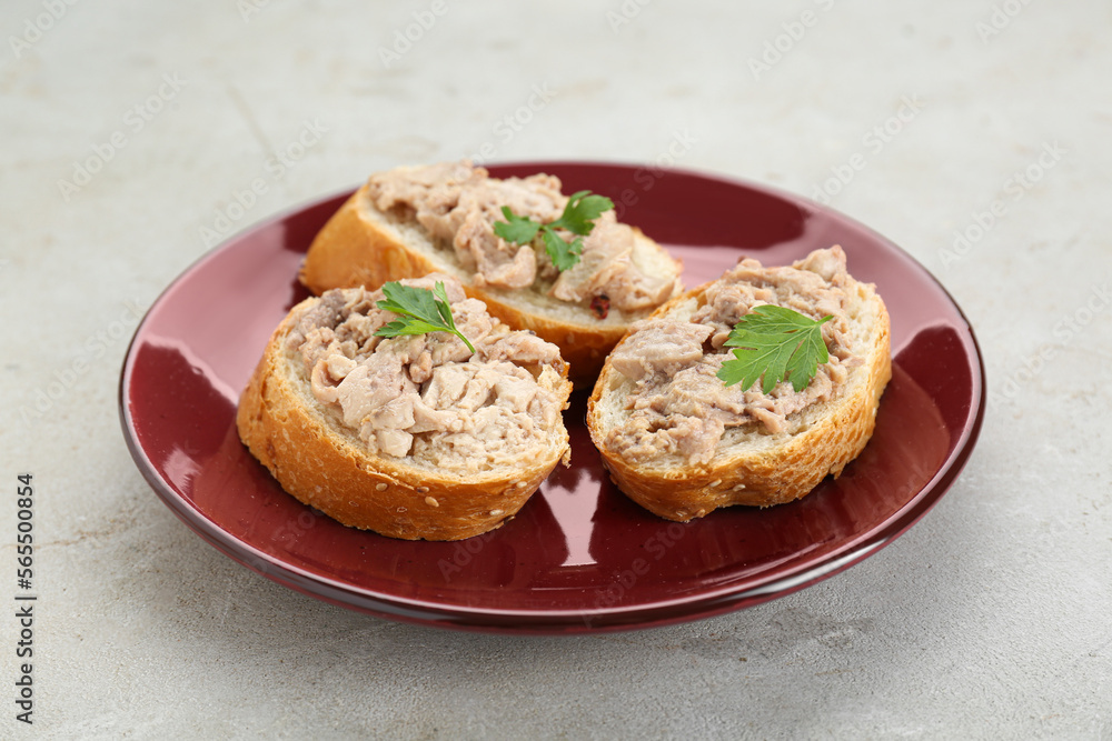 Tasty sandwiches with cod liver on light grey table Tasty sandwiches with cod liver on light grey table