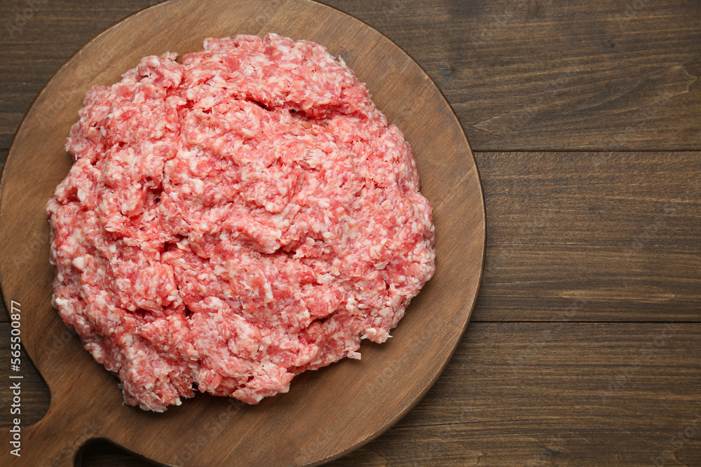 Raw fresh minced meat on wooden table, top view. Space for text Raw fresh minced meat on wooden table, top view. Space for text