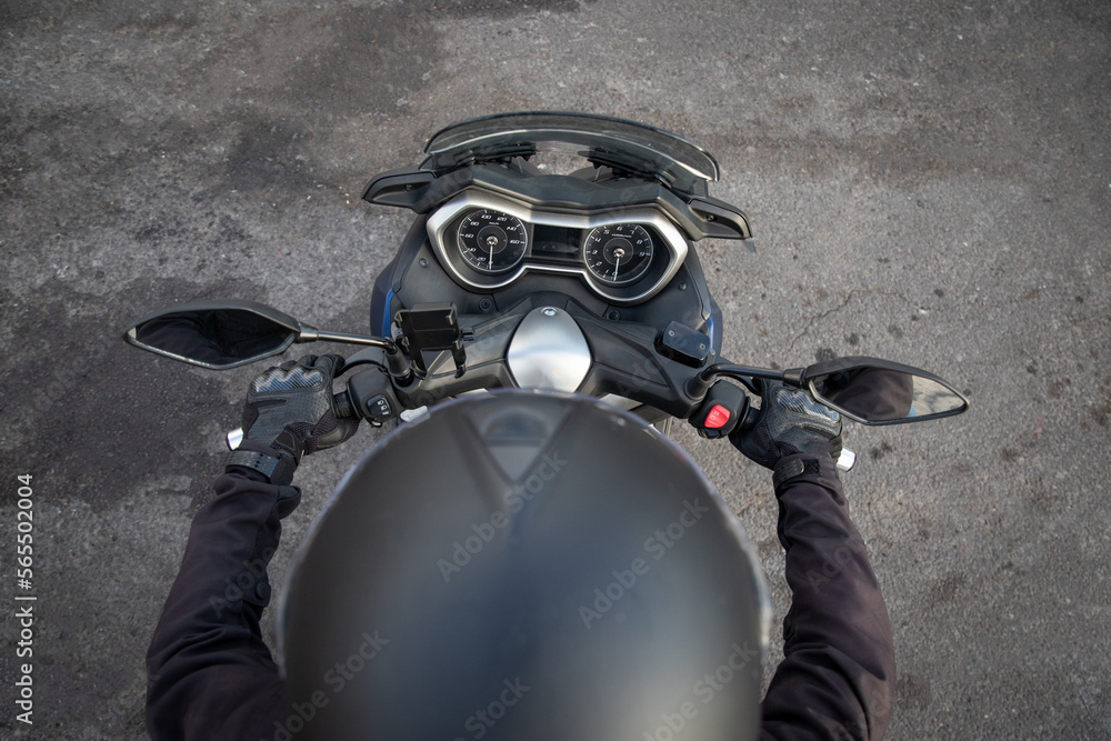 Fototapeta premium Top view of a biker riding his motorcycle, photo with copy space.