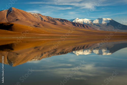 Fototapeta Naklejka Na Ścianę i Meble -  Salt lake Lejia reflection, idyllic volcanic landscape at Sunset, Atacama, Chile