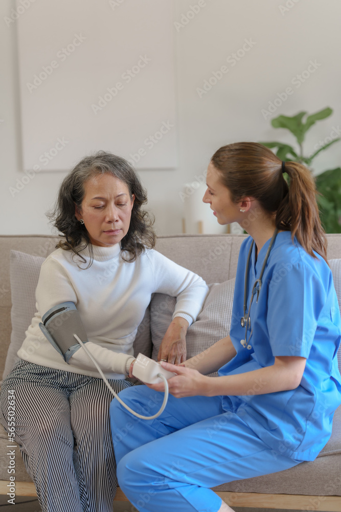 Female doctor taking a history of a patient and counseling on orthopedic diseases with female patients after measuring blood pressure and heart rate in a medical facility Female doctor taking a history of a patient and counseling on orthopedic diseases with female patients after measuring blood pressure and heart rate in a medical facility