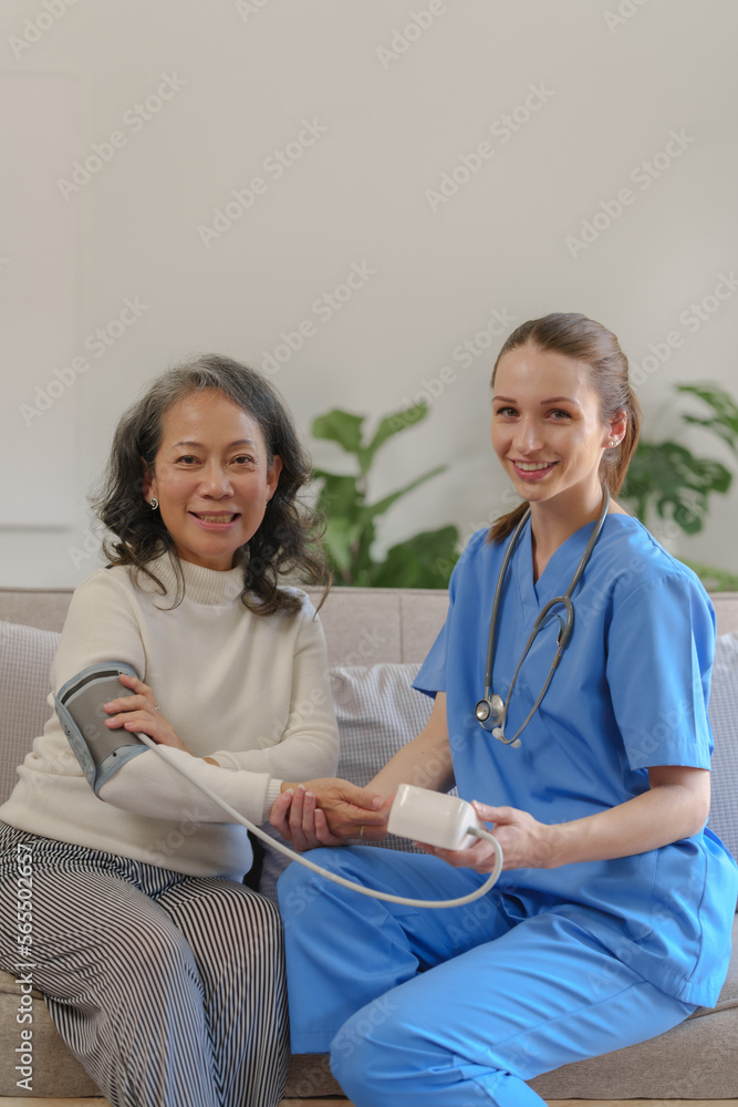 Fototapeta premium Female doctor taking a history of a patient and counseling on orthopedic diseases with female patients after measuring blood pressure and heart rate in a medical facility