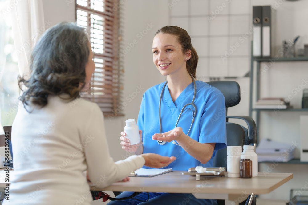 Female doctor taking a history of a patient and counseling on orthopedic diseases with female patients after measuring blood pressure and heart rate in a medical facility Female doctor taking a history of a patient and counseling on orthopedic diseases with female patients after measuring blood pressure and heart rate in a medical facility