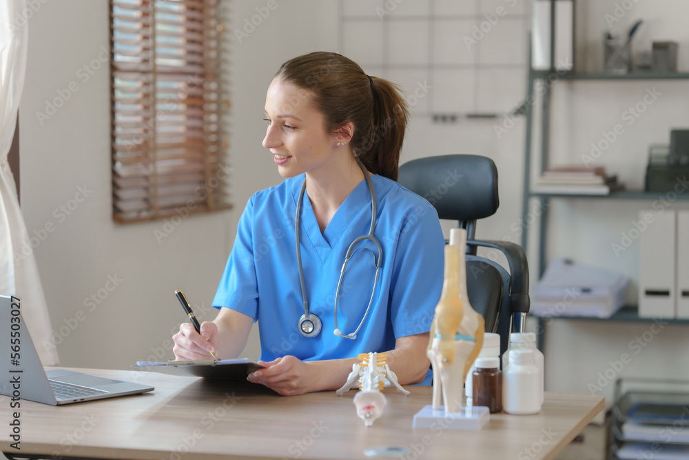 Female doctor taking a history of a patient and counseling on orthopedic diseases with female patients after measuring blood pressure and heart rate in a medical facility Female doctor taking a history of a patient and counseling on orthopedic diseases with female patients after measuring blood pressure and heart rate in a medical facility