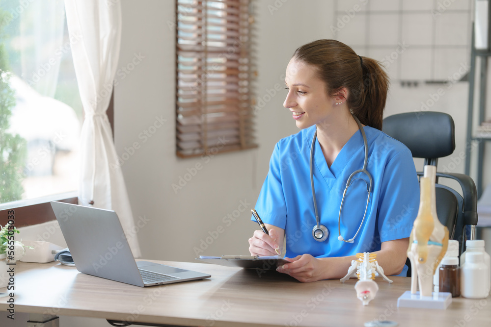 Female doctor taking a history of a patient and counseling on orthopedic diseases with female patients after measuring blood pressure and heart rate in a medical facility Female doctor taking a history of a patient and counseling on orthopedic diseases with female patients after measuring blood pressure and heart rate in a medical facility
