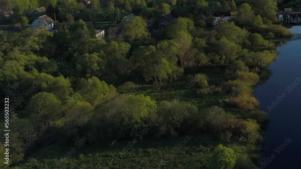 Aerial view of forest river with transparent filled with fresh water surrounded by green field with stunning landscape cinematic views. Concept climate outdoor nature. Aerial view of forest river with transparent filled with fresh water surrounded by green field with stunning landscape cinematic views. Concept climate outdoor nature.