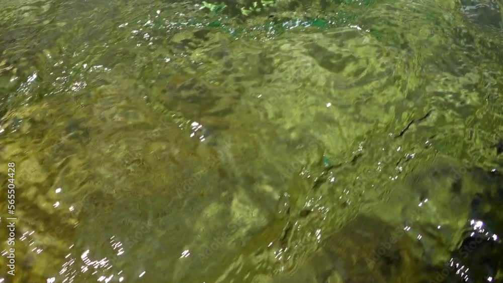 The fast flowing waters of the mountain river sharpen the stone and create incredible patterns. Underwater view. The fast flowing waters of the mountain river sharpen the stone and create incredible patterns. Underwater view.
