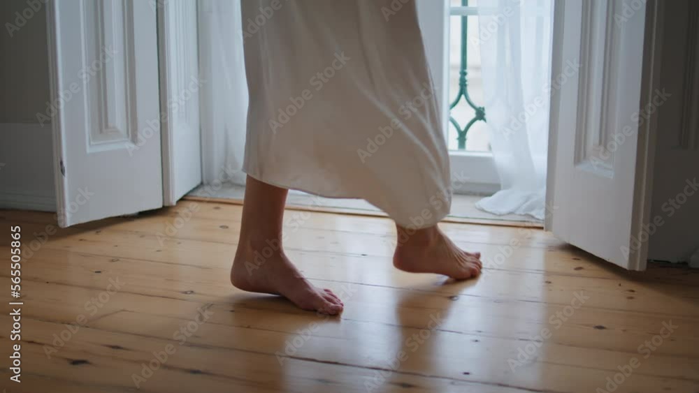 Tender woman legs stepping at morning home closeup. Unknown girl moving at floor Tender woman legs stepping at morning home closeup. Unknown girl moving at floor