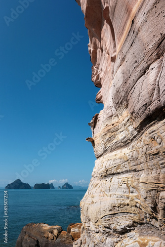 Sandstone rock and islands in Andaman Sea on sunny day. Laem Chamuk Khwai, Krabi Province, Thailand. photo