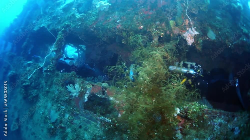Diving in Truk Lagoon of shipwreck on Chuuk Islands. Ship wreck in sea life of Truk. Inside view of wreck in blue lagoon. Diving in Truk Lagoon of shipwreck on Chuuk Islands. Ship wreck in sea life of Truk. Inside view of wreck in blue lagoon.