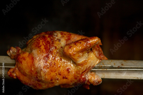 photograph of grilled chicken cooking in an oven. Typical Peruvian food. Food concept, oven and Peruvian traditions.